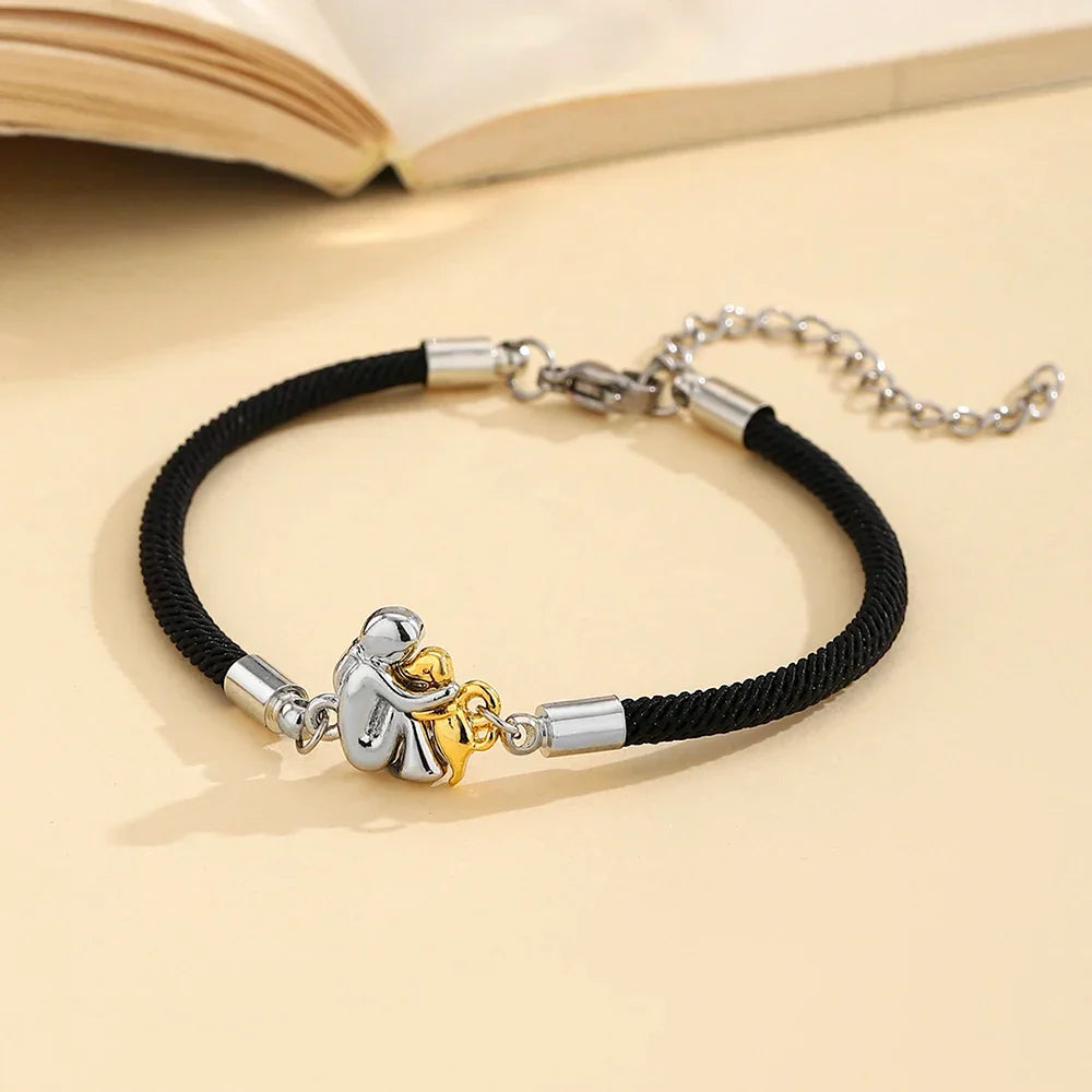Harper – Black Cord Dog Embrace Bracelet (Silver & Gold Charm)
